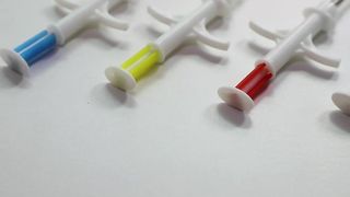 Animal ID tag with syringe